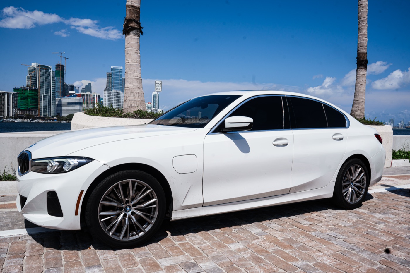 BMW 330e – side profile, Miami skyline