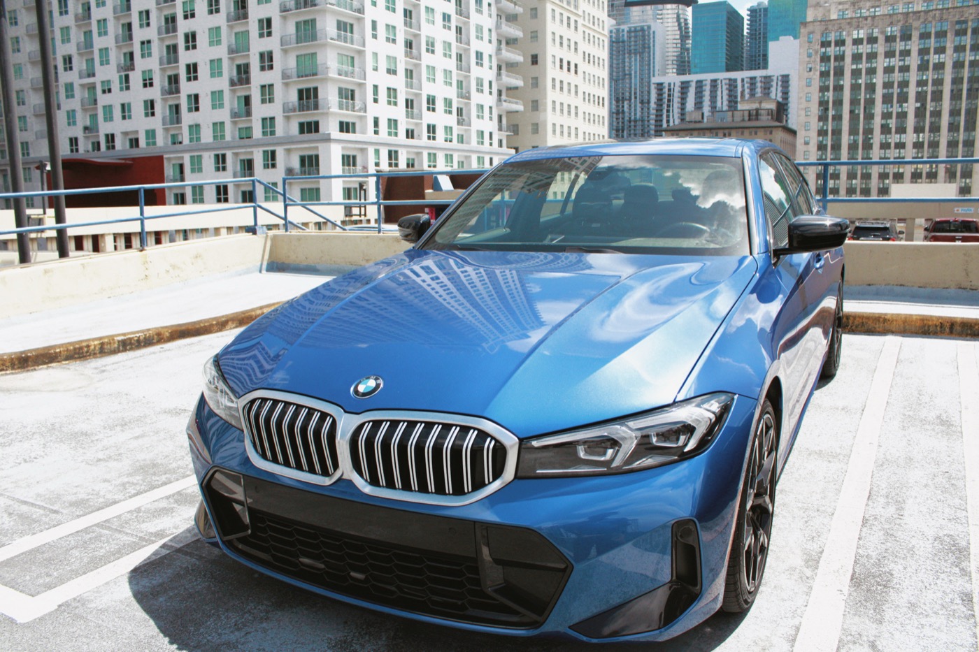 BMW 330i – front three-quarter, Portimao Blue